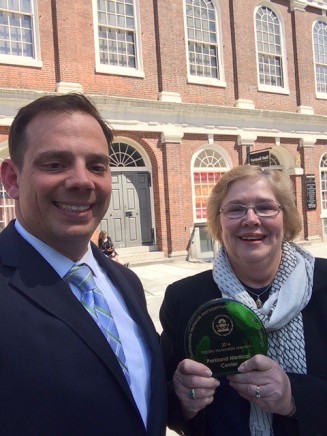 Jacob Wiesmann and Peggy Connors outside of Faneuil Hall in Boston to accept the award